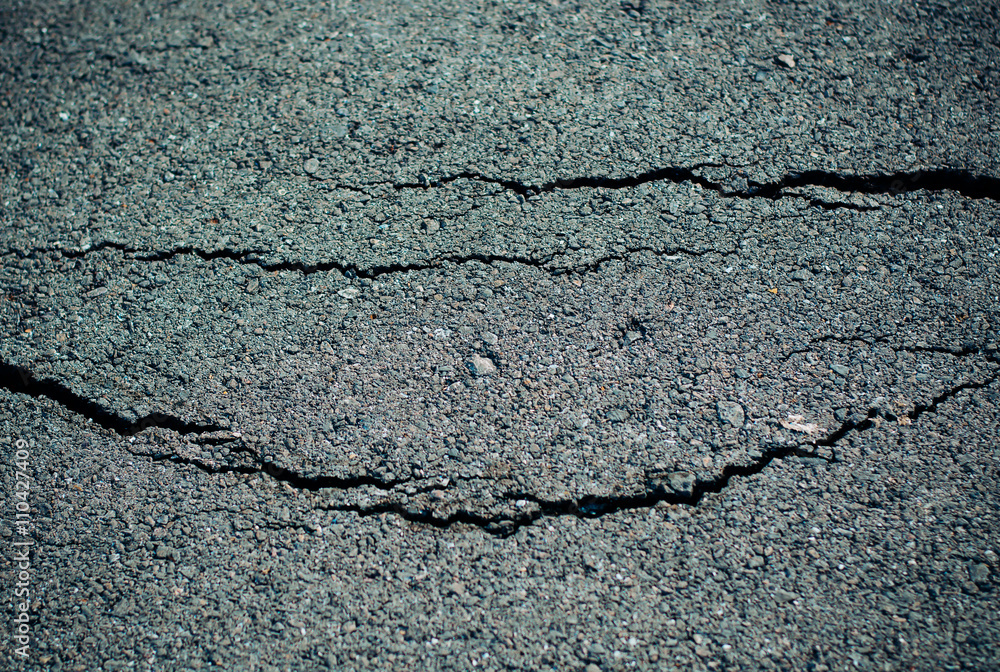 Obraz premium road cracks background texture