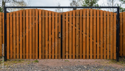 Fotografie Part of  a wooden gate with metal ring handle