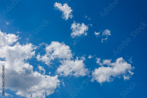 white fluffy clouds in blue sky