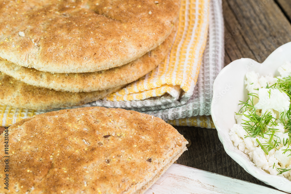 Fresh crumbled feta cheese with cut fresh dill, flatbread - ingredients for sandwich. Fresh crumbled feta cheese with cut fresh dill, flatbread - ingredients for sandwich.