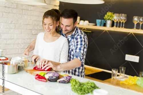 Loving couple preparing healthy food photo