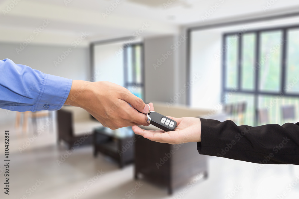 Buying Car. Businessman giving a key car to businesswoman Buying Car. Businessman giving a key car to businesswoman