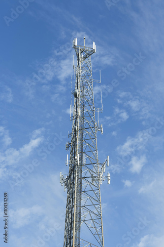 Satellite dish telecom tower on blue sky background