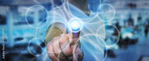 Naklejka Businessman touching modern tactile screen button