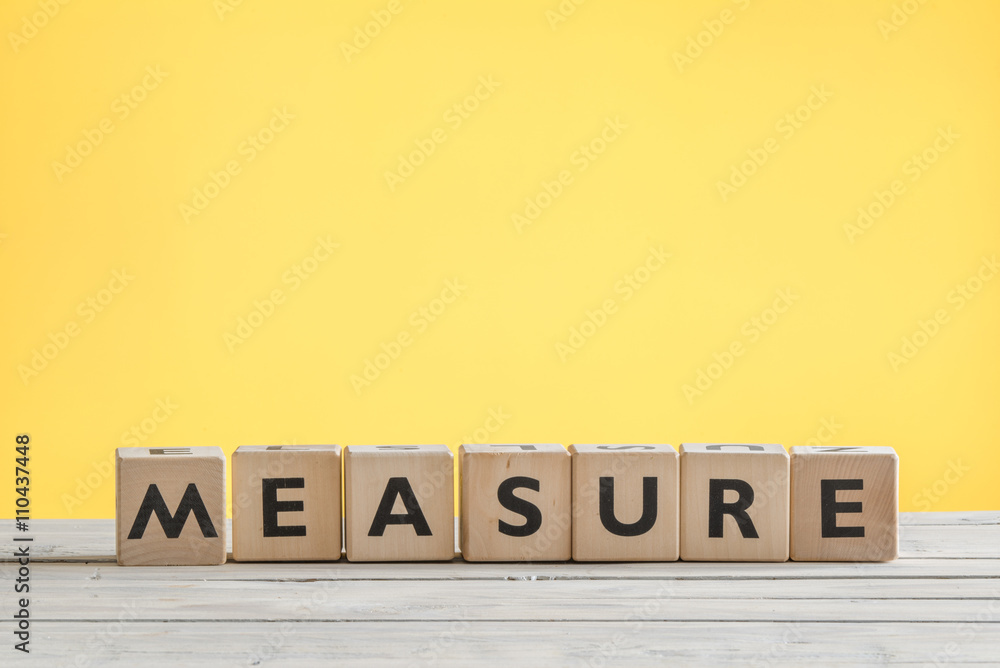 Measure sign on a yellow background Measure sign on a yellow background