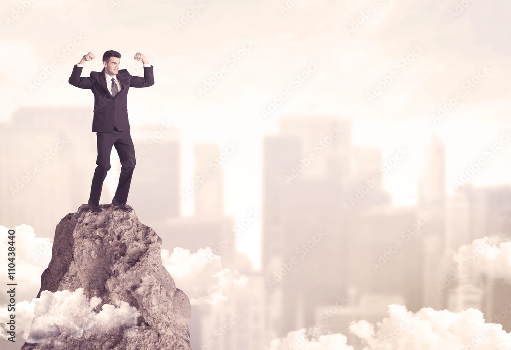Confident businessman on dangerous cliff Confident businessman on dangerous cliff