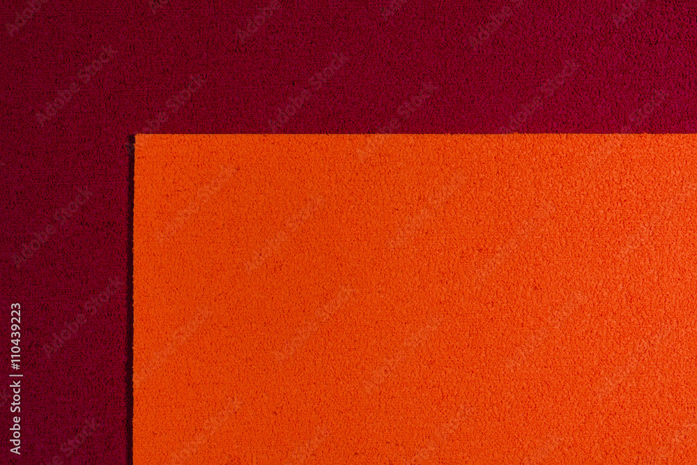 Eva foam ethylene vinyl acetate orange surface on red sponge plush background