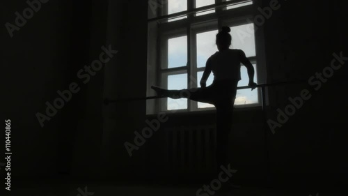 Wallpaper Mural Silhouette of a Ballet Dancer Exercising at The Barre By The Window Torontodigital.ca