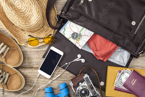 Holiday suitcase on wooden table