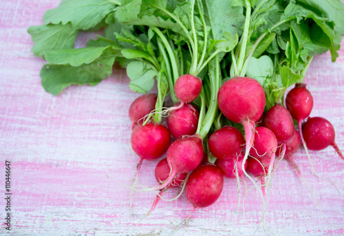 radishes on wooden surface