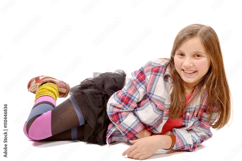 smiling little girl lying on the floor isolated on white smiling little girl lying on the floor isolated on white