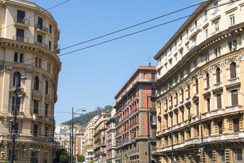Historical street with the typical colourful facades in Naples in Italy
