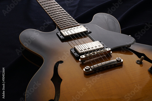 Closeup of old electric guitar. Detail, selective focus.
