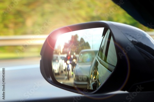 Car side mirror view with sunlight glare © razihusin