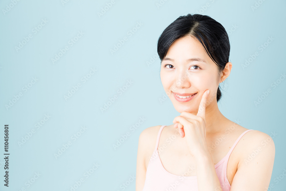attractive asian woman skincare image on blue background attractive asian woman skincare image on blue background