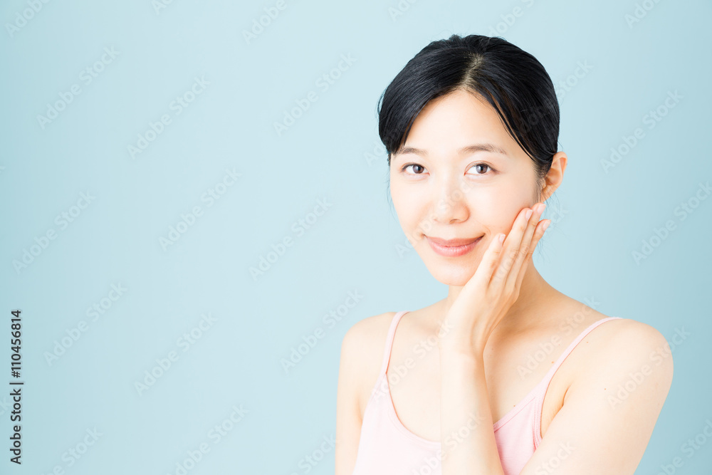 attractive asian woman skincare image on blue background attractive asian woman skincare image on blue background