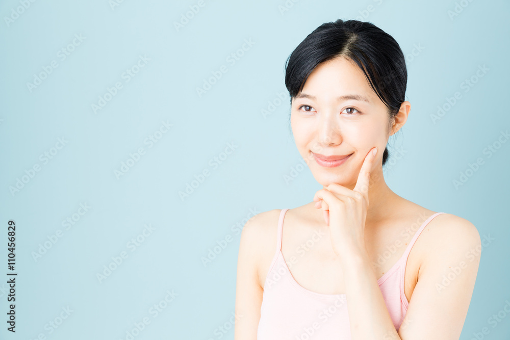 attractive asian woman skincare image on blue background attractive asian woman skincare image on blue background