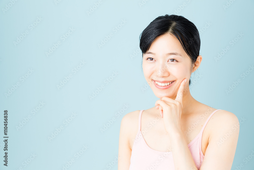 attractive asian woman skincare image on blue background attractive asian woman skincare image on blue background