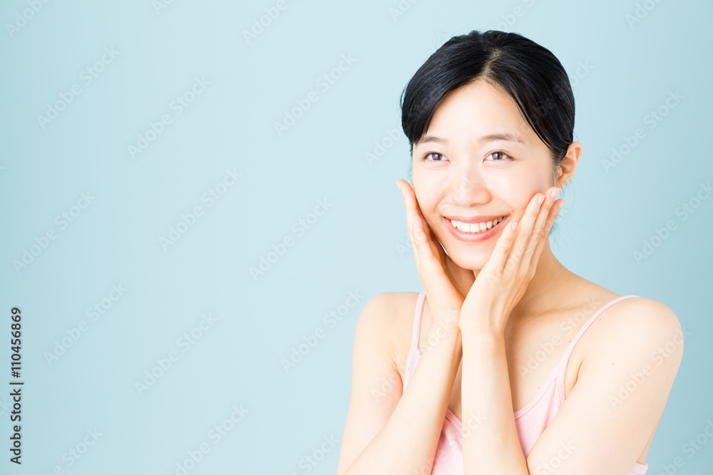 attractive asian woman skincare image on blue background attractive asian woman skincare image on blue background
