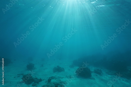 Ocean floor with sunlight through water surface, natural scene underwater, Pacific ocean, French Polynesia