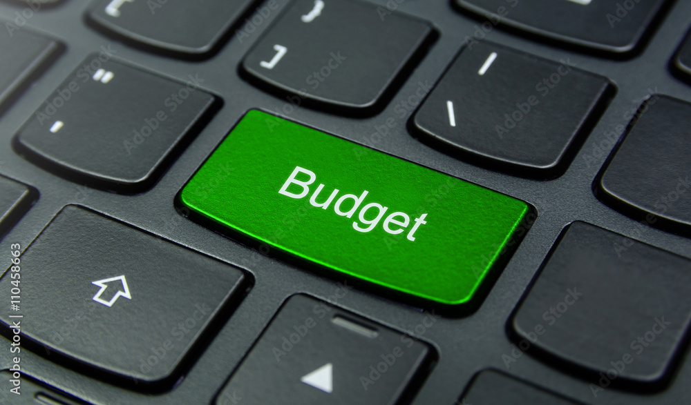 Business Concept: Close-up the Budget button on the keyboard and have Lime, Green color button isolate black keyboard Business Concept: Close-up the Budget button on the keyboard and have Lime, Green color button isolate black keyboard
