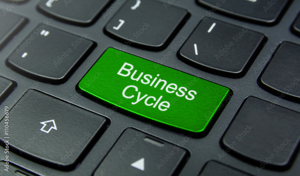 Business Concept: Close-up the Business Cycle button on the keyboard and have Lime, Green color button isolate black keyboard Business Concept: Close-up the Business Cycle button on the keyboard and have Lime, Green color button isolate black keyboard