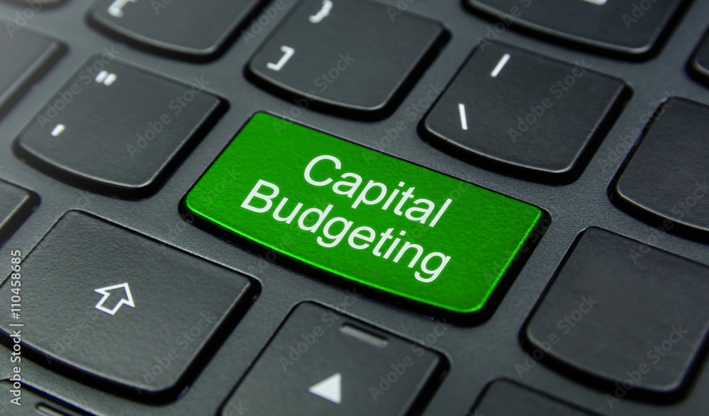 Business Concept: Close-up the Capital Budgeting button on the keyboard and have Lime, Green color button isolate black keyboard Business Concept: Close-up the Capital Budgeting button on the keyboard and have Lime, Green color button isolate black keyboard