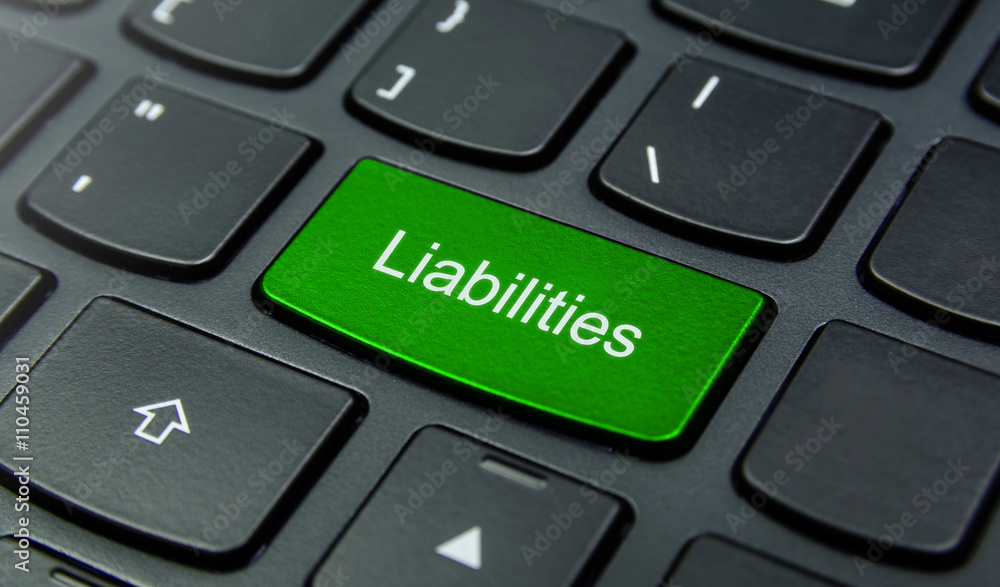 Business Concept: Close-up the Liabilities button on the keyboard and have Lime, Green color button isolate black keyboard Business Concept: Close-up the Liabilities button on the keyboard and have Lime, Green color button isolate black keyboard