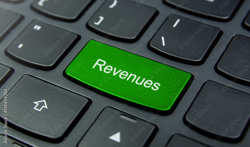 Business Concept: Close-up the Revenues button on the keyboard and have Lime, Green color button isolate black keyboard Business Concept: Close-up the Revenues button on the keyboard and have Lime, Green color button isolate black keyboard