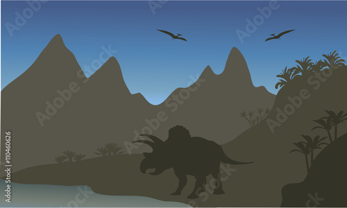 Silhouette of pterodactyl and triceratops