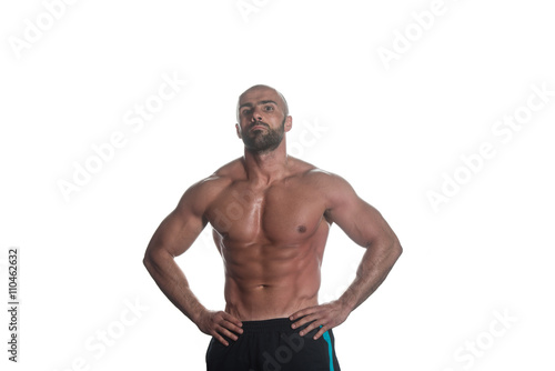 Portrait Of A Bodybuilder Posing Over White Background © Jale Ibrak