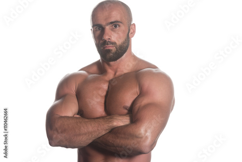 Portrait Of A Bodybuilder Posing Over White Background