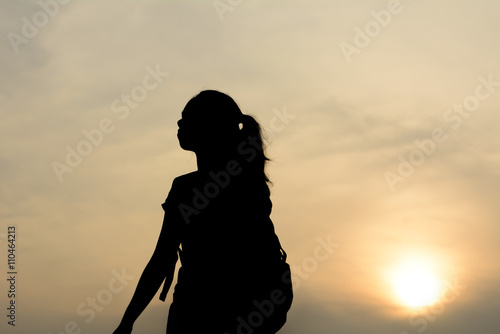 Silhouette women tourists.Background sunset