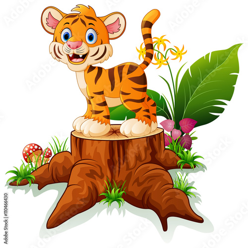 Fototapeta Naklejka Na Ścianę i Meble -  Cartoon funny baby tiger posing on tree stump 