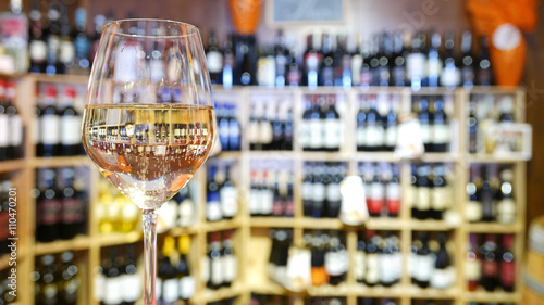 White wine glass in an Italian wine bar. photo