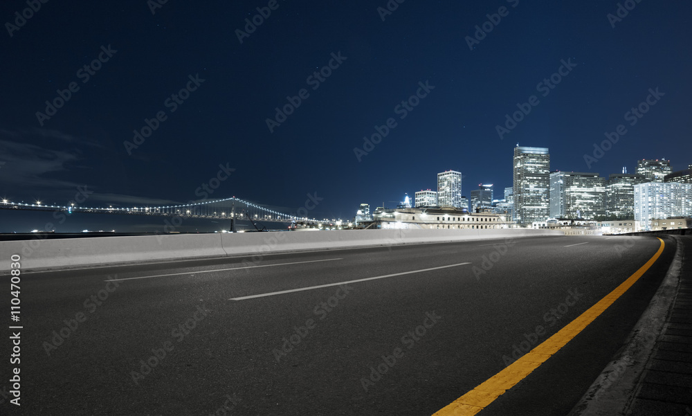 empty asphalt road with cityscape and skyline of san francisco