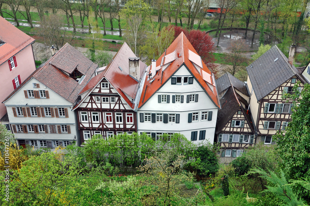 Top view of typical half-timbered houses standing in the row with gardens in the foreground. Baden-Wurttemberg, Germany. Top view of typical half-timbered houses standing in the row with gardens in the foreground. Baden-Wurttemberg, Germany.