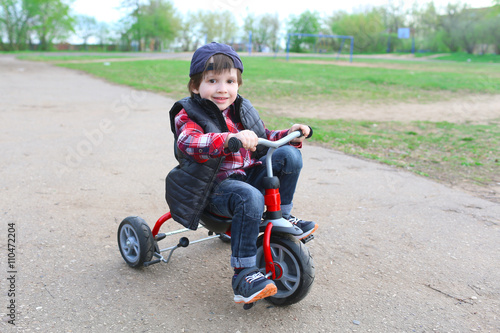 Happy boy (3 years) on bike