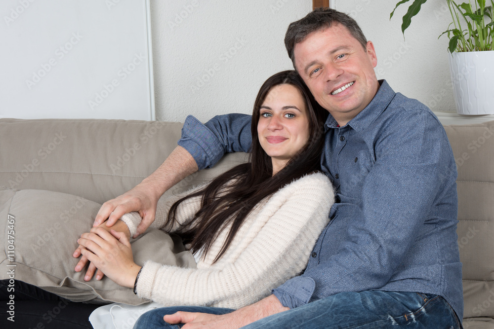 Portrait of a middle aged man smiling with young woman