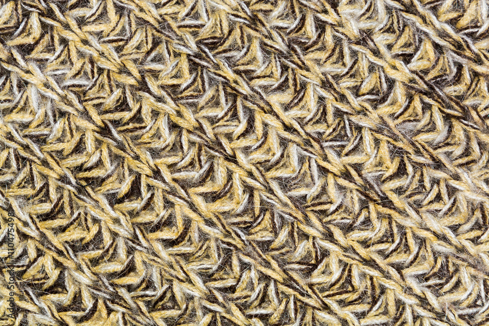 mottled diagonal texture of the wool yellow brown knitted fabric mottled diagonal texture of the wool yellow brown knitted fabric