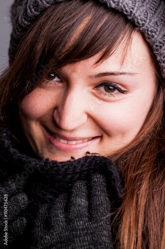 winter portrait of a happy woman with hat