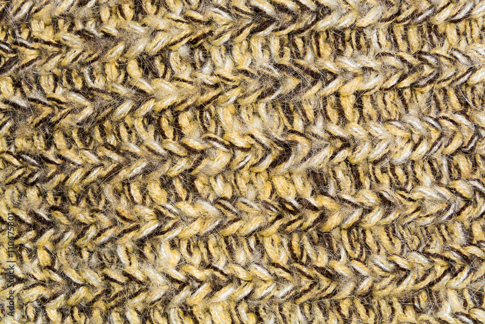 mottled horizontal texture of the wool yellow brown knitted fabric mottled horizontal texture of the wool yellow brown knitted fabric
