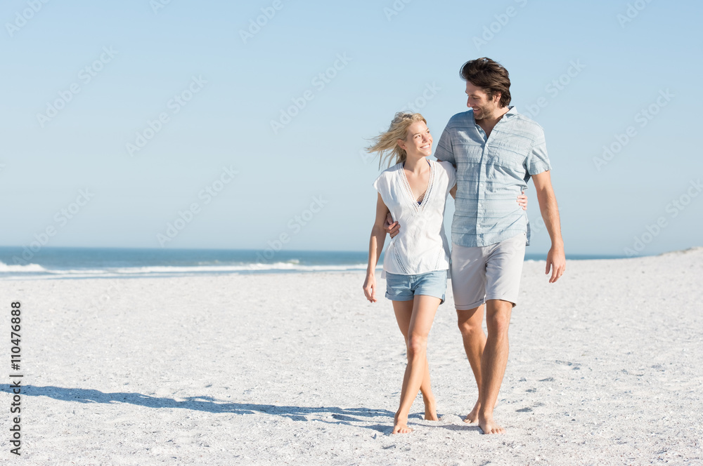 Couple walking at beach Couple walking at beach