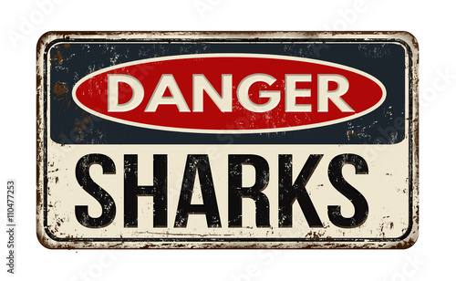 Danger sharks rusty metal sign