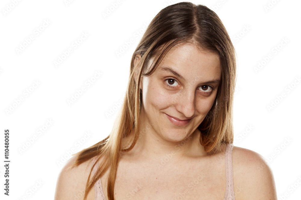 smiling young woman without makup on a white background smiling young woman without makup on a white background