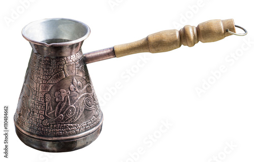 Turk for brewing coffee with oriental ornaments in the form of ancient oriental emblem on a white background 