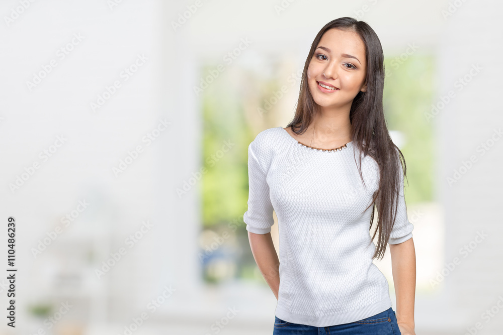 Casual mixed-race Asian Caucasian woman smiling looking happy