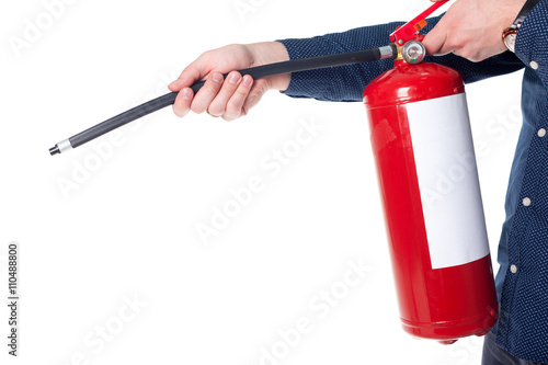 Man using fire extinguisher isolated on white