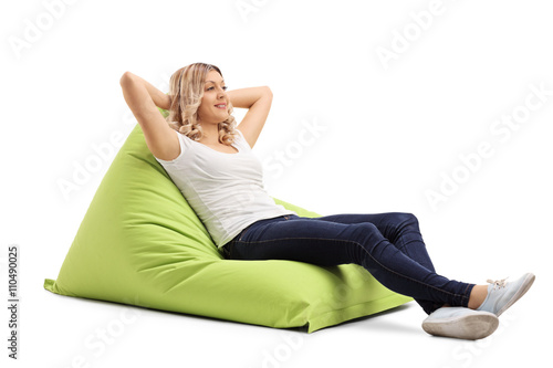 Woman sitting on a comfortable beanbag