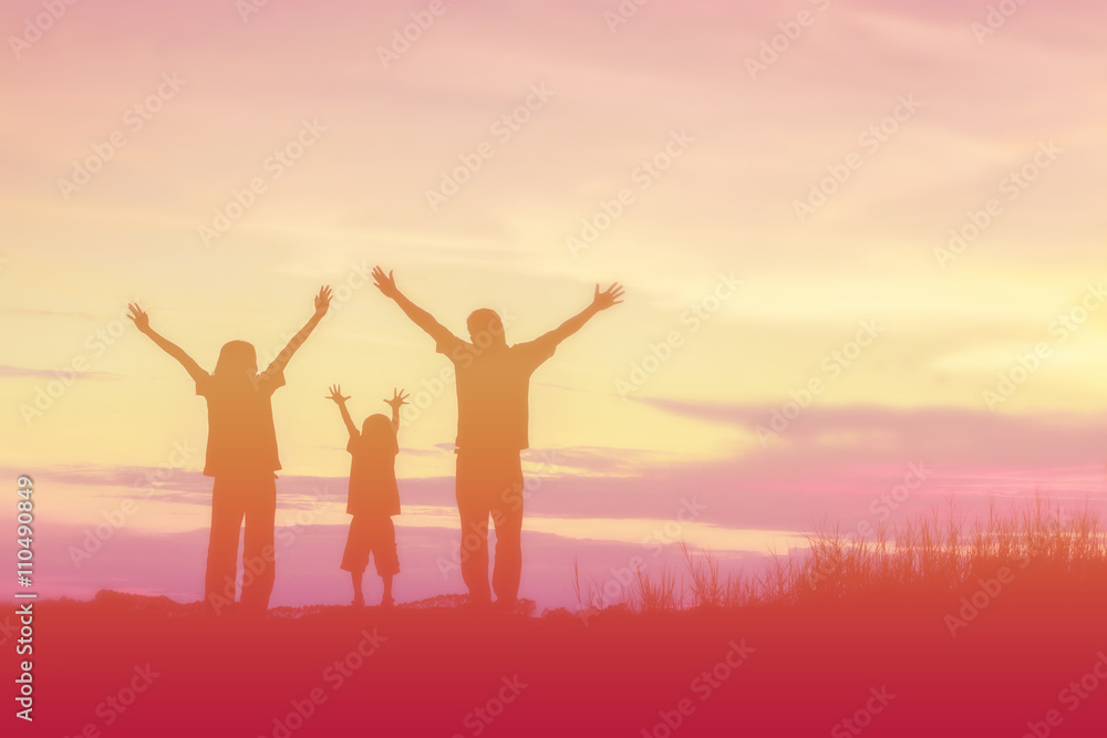 silhouette of a happy family and happy time sunset
